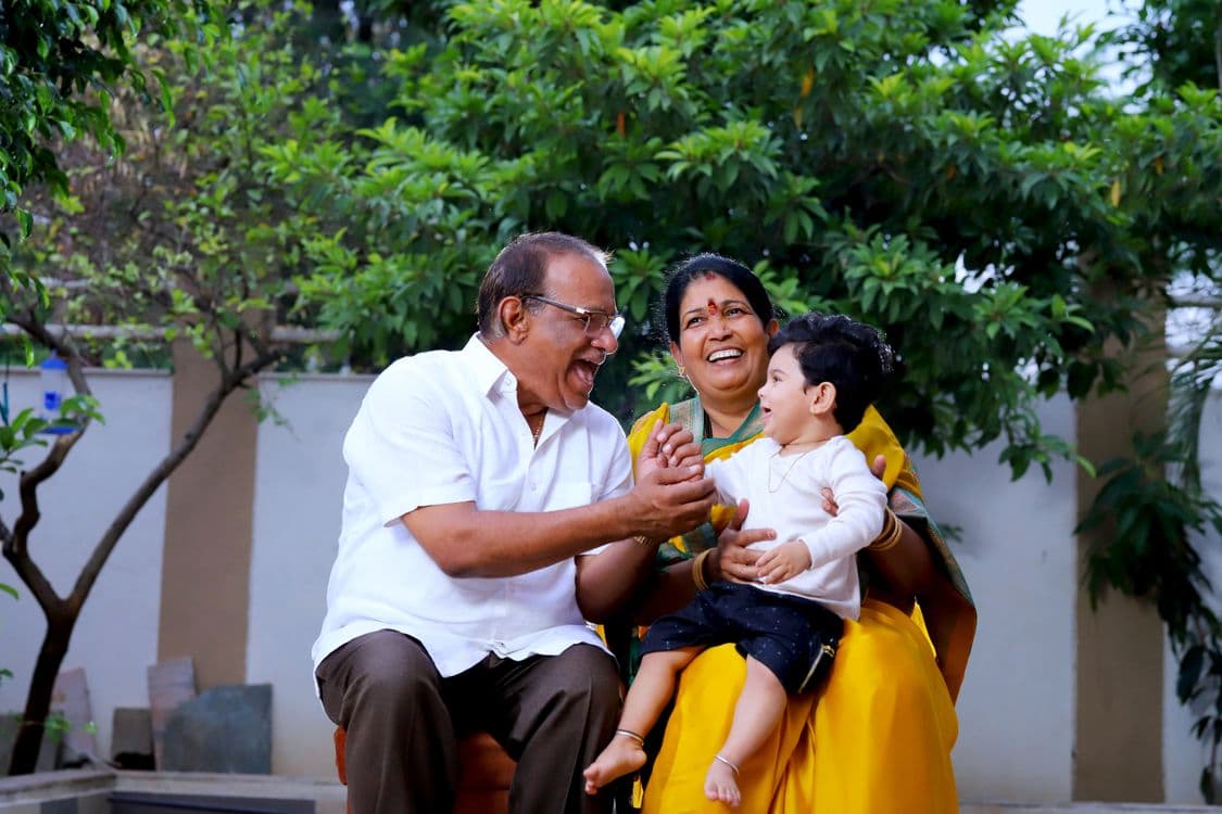 Happy Indian grandparents and family supported by VR Healthcare home care services